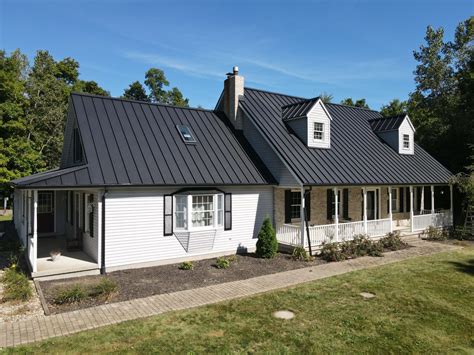 copper metal roof black house|black standing seam metal roofing.